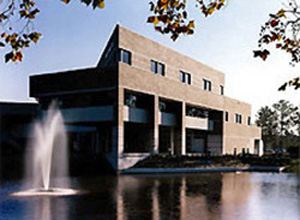 Exterior view of the College of Business Administration at the University of North Florida with water feature in the foreground