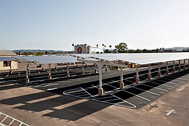 PV collectors mounted on structures so they also provide shade to the cars that park beneath them