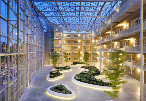Example of a typical atrium with large glazing areas on walls and roof and plantings on ground level