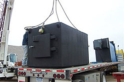 Photo showing the delivery of a combustor and boiler on the back of a semi truck in Boulder County, Colorado