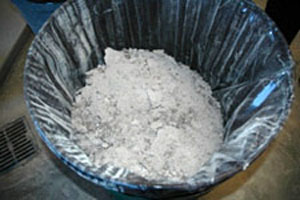 Photo of a can filled with ash created by wood combustion