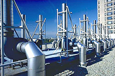 Photo of HVAC equipment mounted on a building's rooftop