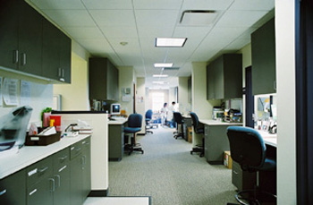 Medical assistant stations with accessible storage and plenty of workspace - Community Health Care clinic in Lakewood in Washington