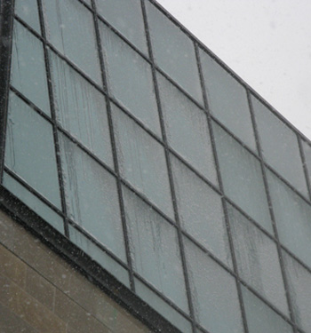 Snow and ice adhering to a building curtain wall