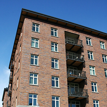 Balcony elements inset to exterior walls