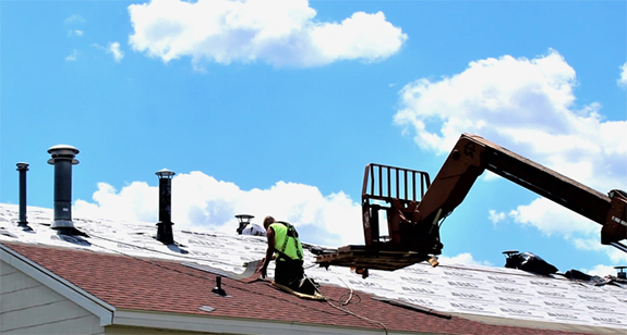 contractor replacing roofing at Fort McCoy