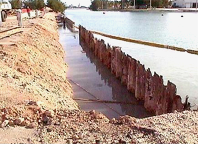 corroded steel sheet pile bulkhead with areas of complete failure