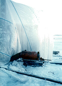 BUR being applied during very cold weather, which should not be permitted, with warm air being blown into an air-supported enclosure