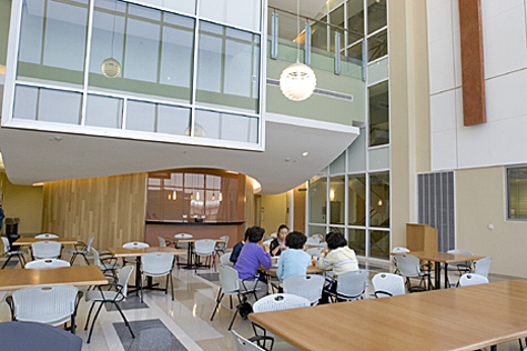 Large tables and seating areas outside labs and offices