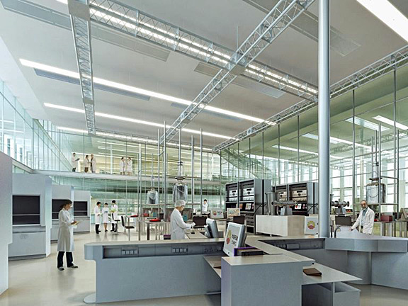 Interior photo of lab within PetroChina with very high ceilings allowing a lot of daylight; it is very open and uses a lot of glass, even the catwalk has glass walls, and h