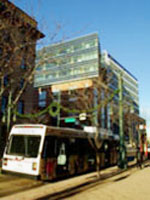 The pedestrian avenue with a bus passing by in front of the EPA Region 8 Headquarters in Denver CO