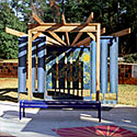 Custom-designed wooden playground structure of a theater stage