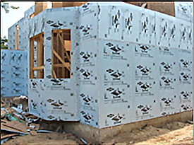 Example of rigid foam board insulation on the exterior of a house under construction