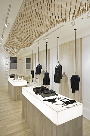 Retail space with light up counters and merchandise hanging from ceilings