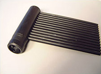 Photo of a black solar collector attached to a tube-shaped header pipe