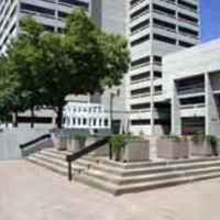 office buildings with a plaza of steps, planters, and landscaping