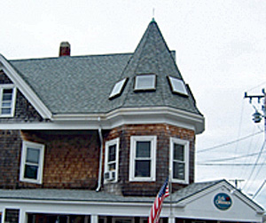 Historic building with small skylights installed on the turret