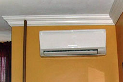 View of split ductless HVAC system inside apartment.