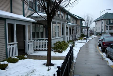 a street view illustrating zero-step entrances in a snowy climate